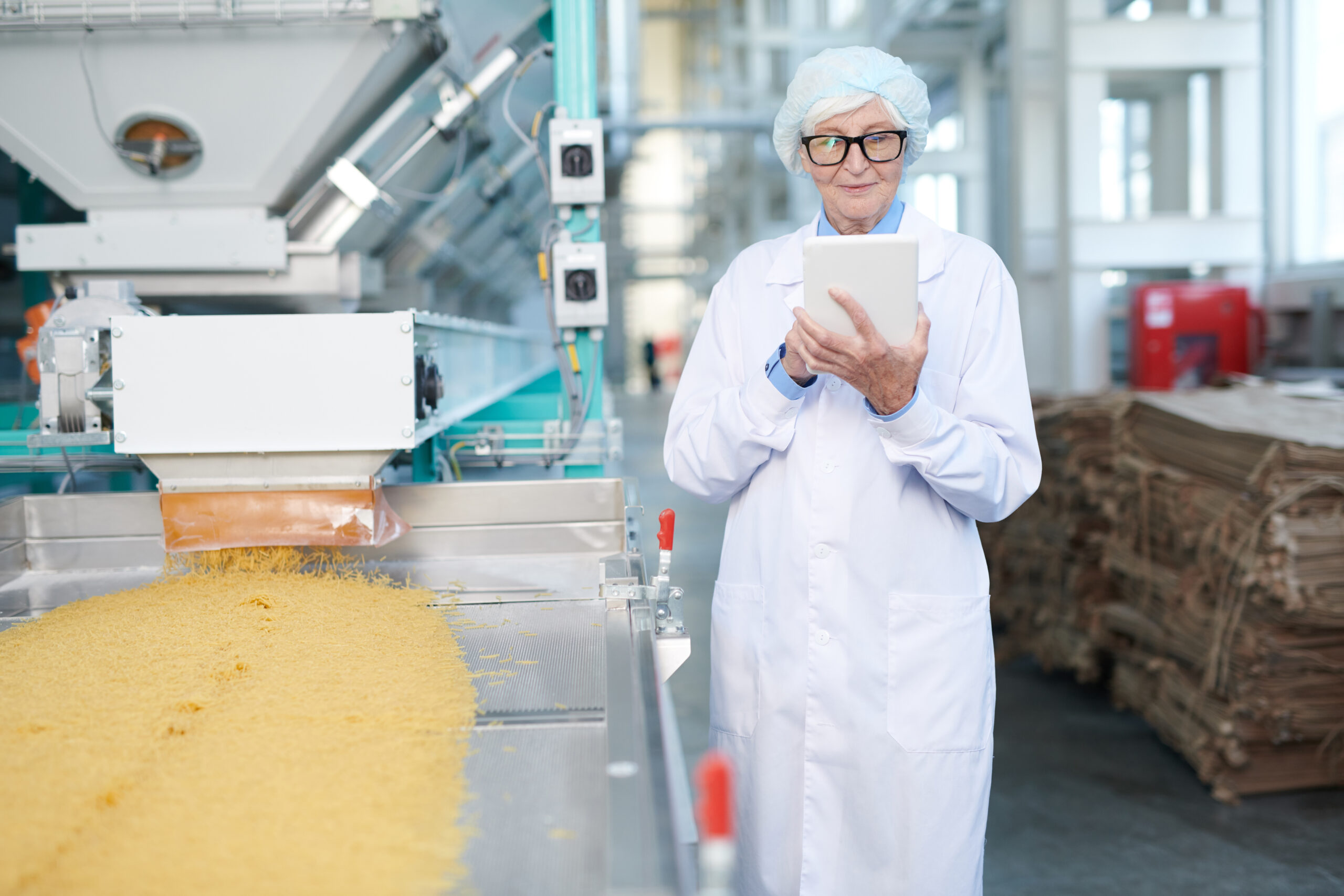 Smiling Senior Woman at Factory